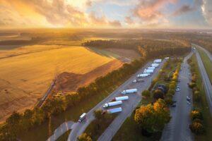 Rest area for semi trucks near busy interstate freeway. Truck stop place during hauling cargo