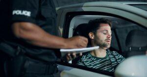 Man, police and writing of ticket fine, registration and speeding for traffic warning. Person, law enforcement and licence for drunk driving, penalty receipt and transport risk for violation at night.